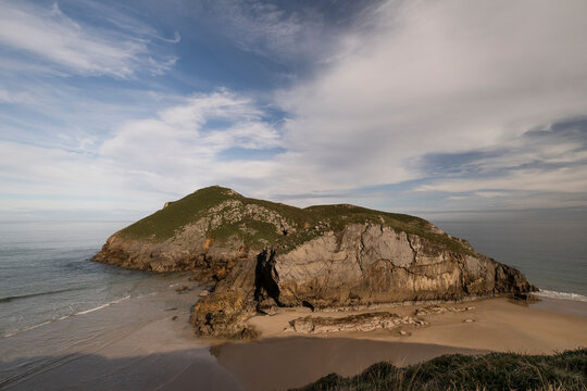 The island of La Almenada and its tombolo in the Green Coast of Llanes, Asturias, northern Spain