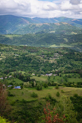 Obraz premium Landscape with green mountains and cloudy sky. Ariege Pyrenees France