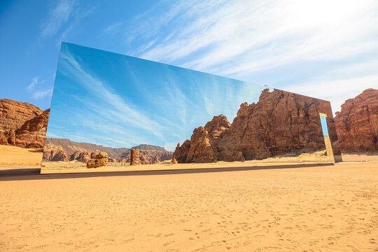 Ashar Valley,AlUla, Saudi Arabia-Jan 5,2025: Maraya concert hall reflecting Ashar Valley environment with rock formations and blue sky, blending modern architecture with nature