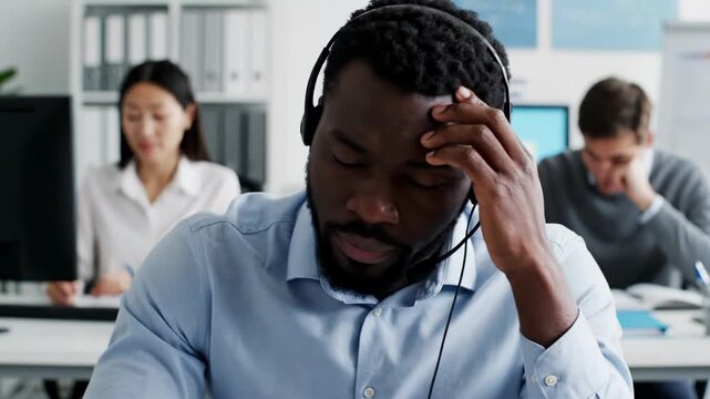 Stressed call center workers in an office environment