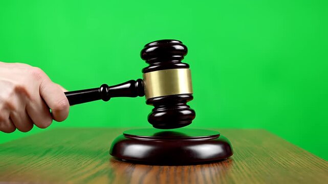 Judges Gavel Striking Sound Block Symbolizing Justice and Law.