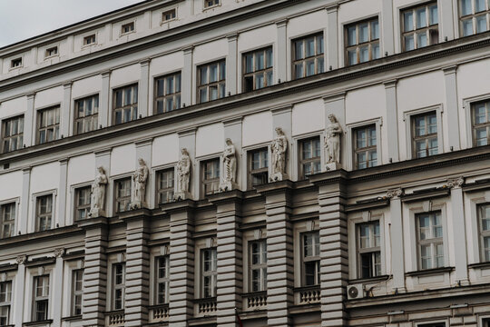 Historic building facade with classical sculptures and windows in Belgrade Serbia. Concept of heritage architecture, culture and European history
