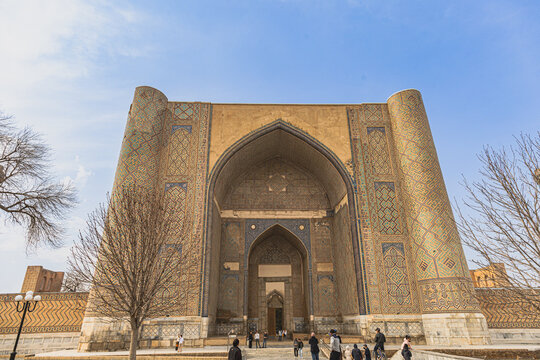 The massive monumental entrance iwan portal of the historic Bibi Khanym Mosque flanked by towering minarets in Samarkand, Uzbekistan. 03.07.2026, Samarkand, Uzbekistan