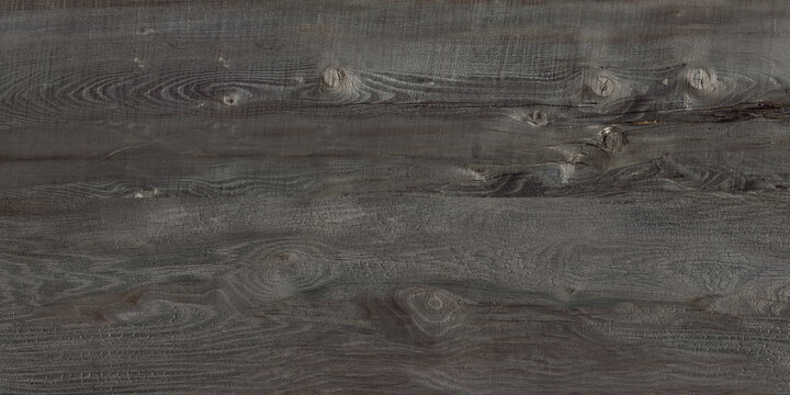Dark grey background of knotty and grainy wood