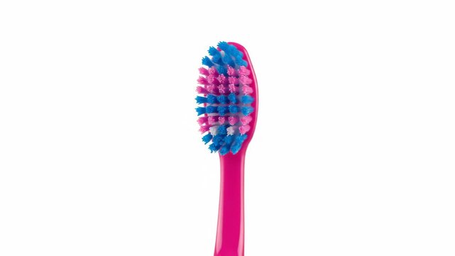 A modern pink toothbrush head shown from three different angles in a composite set. Concept for daily oral hygiene, dental care products, and personal grooming