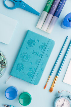 Blue and Green School Supplies Flat Lay