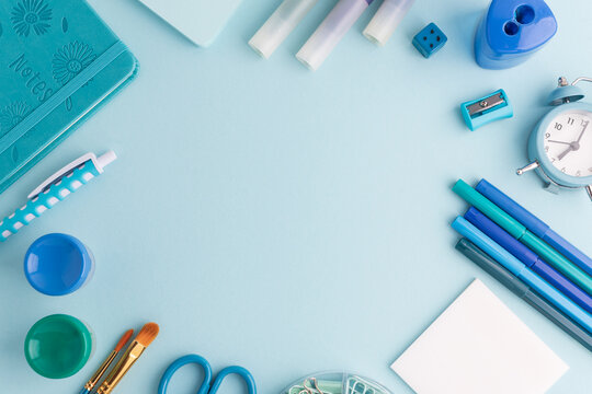 Blue and Green School Supplies Flat Lay