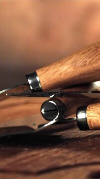 Cheese knives fall onto the cutting board. Filmed on a high-speed camera at 1000 fps. High quality FullHD footage