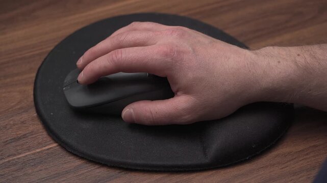 Double clicking mouse on ergonomic mousepad, close up view