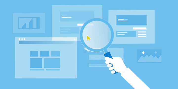 hand holding magnifying glass over web page layouts