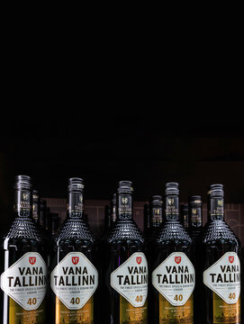 Tallinn, Estonia, March 24th 2025. Vana Tallinn liqueur bottles in a duty free store shelf, with black copy space above. Estonian alcoholic beverage in branded glass bottles with labels
