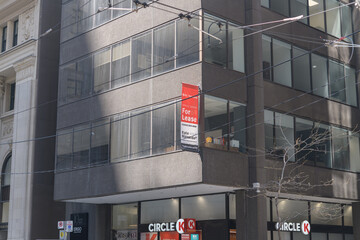 Naklejka premium For Lease sign outside 10 King St E, location of Circle K, a convenience store chain, Toronto