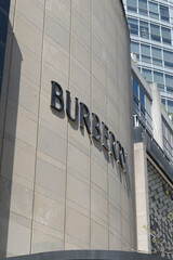 Fototapeta premium oblique angle view of facade and sign of Burberry, a clothing store, located here at 144 Bloor St W, Toronto