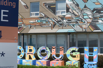 Fototapeta premium mural and jaunty sign outside 772 Warden Av, Scarborough, Toronto (Clairlea Food Bank)