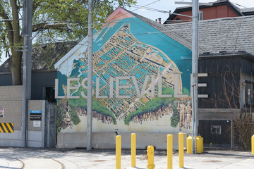 Naklejka premium Leslieville mural and sign on east wall of property at 1401 Queen St E next to TTC Russell Yard, Toronto