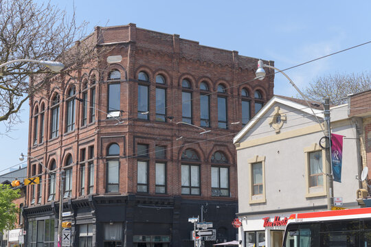wide view of Poulton Block (Orient Hall Masonic Lodge), designed by Kennedy, Gaviller & Holland, 1886, 792 Queen St E, Toronto (St Mary Pharmacy/Tim Hortons, at Boulton Av)