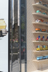 Naklejka premium neat rows of toys in display window at Louis Vuitton, a luxury leather goods store, located at 150 Bloor St W, Toronto