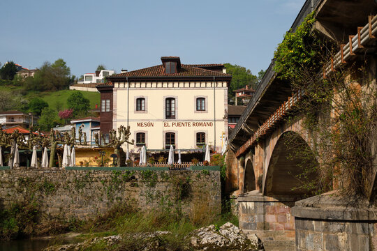 Restaurant next to Bridge over The Sella river as it passes through Cangas de Onis, Asturias, Spain