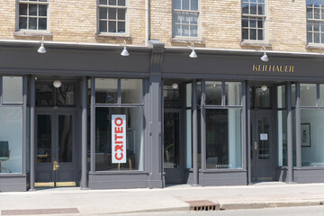 Naklejka premium detail of Daniel Brooke Building (150-154 King St E), built c1833 with later work, and signs for Criteo Canada Corp and Keilhauer, Toronto