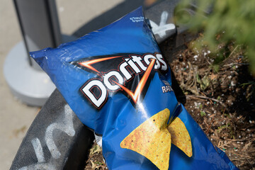 Naklejka premium discarded Biaxially Oriented Polypropylene (or bag) of Frito-Lay Doritos flavored tortilla chips, Toronto