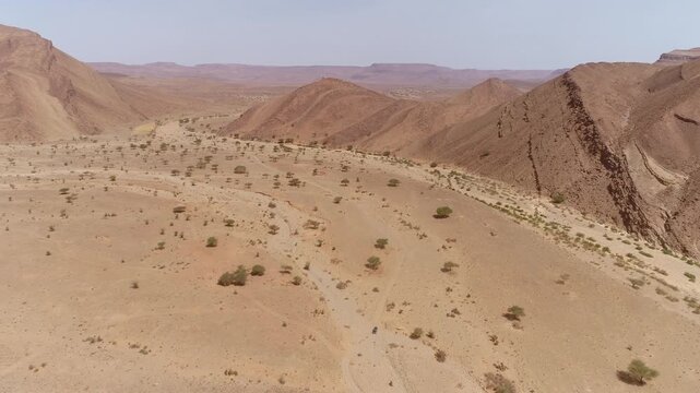 Aerial Vast Dry Wadi Serpentine Desert Plain Canyon Escarpment Morocco
