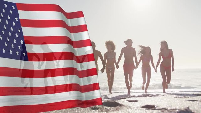 Five adults walking toward lens on shore, breeze causing flag overlay revealing forms for marketing