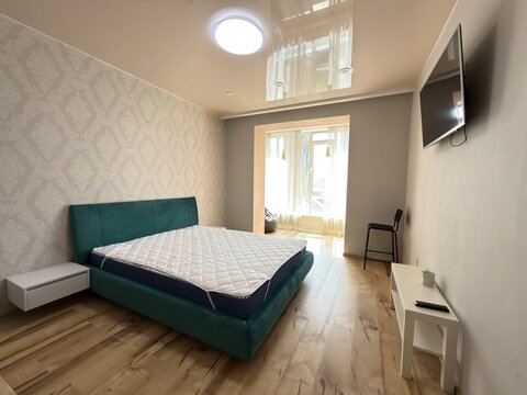 Modern minimalist bedroom interior with large window