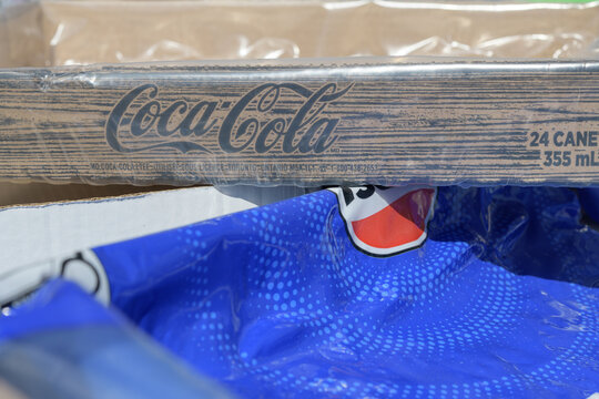 close-up of a Coca-Cola corrugated tray on plastic Pepsi shrink wrap, Toronto