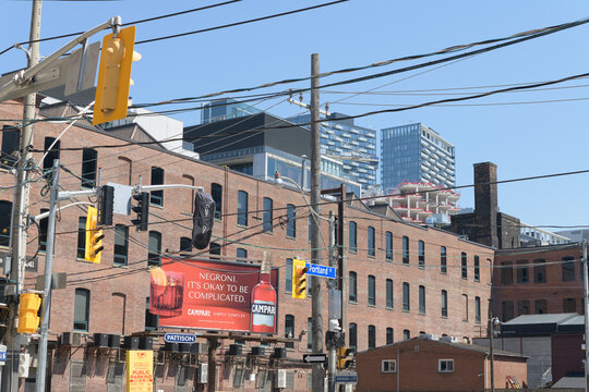 roadside billboard featuring advertising for Campari bitters at the corner of Portland St and Adelaide St W, Toronto