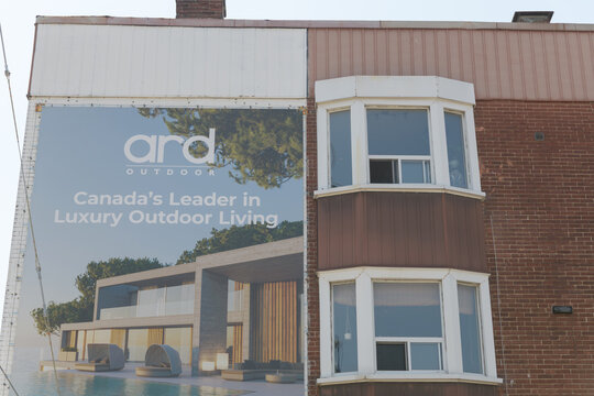 traditional banner advertisement for ARD, a high-end patio and luxury garden furniture company, and vernacular architecture on Davenport Rd, Toronto