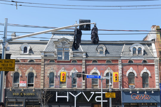historic commercial block with sign of HYVE, a night club, located at 508 Queen St W, Toronto
