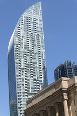 Naklejka premium dramatic, sculptural sweep of L-Tower's curved top profile designed by Daniel Libeskind at 8 The Esplanade (contrast with Dominion Public Building) Toronto