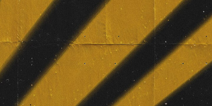 Golden diagonal stripes texture with subtle grain and warm lighting on dark background