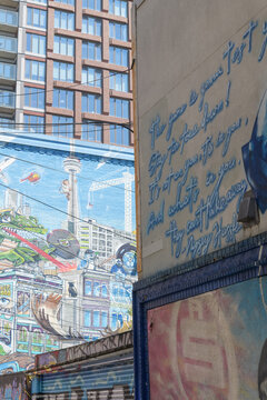 mural on the west facing wall of 530 Richmond St W with architectural pattern of RUSH Condos, 520 Richmond St seen from Graffiti Alley / Rush Ln, Toronto
