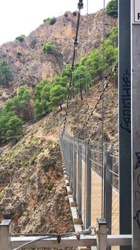 Hiking trail to Colgante bridge (Puente Colgante El Saltillo) over Almanchares river, Sierra Tejeda, Andalusia, Spain