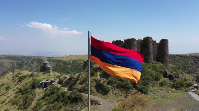 Aerial view of the historic medieval Amberd Fortress in Armenia on a sunny summer day under a blue sky. Spring scene, shot with a drone