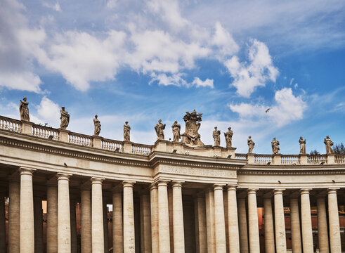 The colonnades of St. Peter's Square (17th century), designed by Gian Lorenzo Bernin, Vatican City, a prominent landmark in Rome, Italy, Europe 