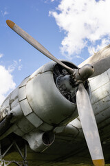 A preserved aircraft propeller and radial engine photographed from below, showcasing classic aviation technology and museum preservation. © Alejandro