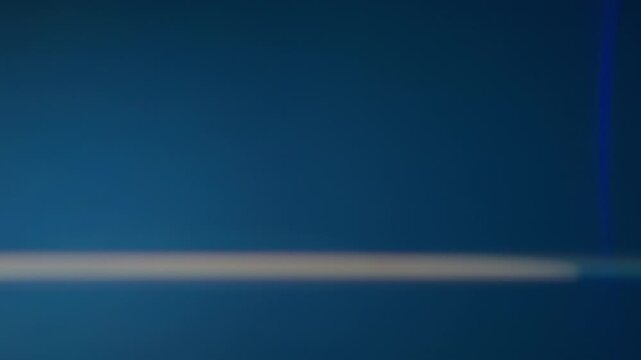 Blue anamorphic abstract lens flare with horizontal light leaks