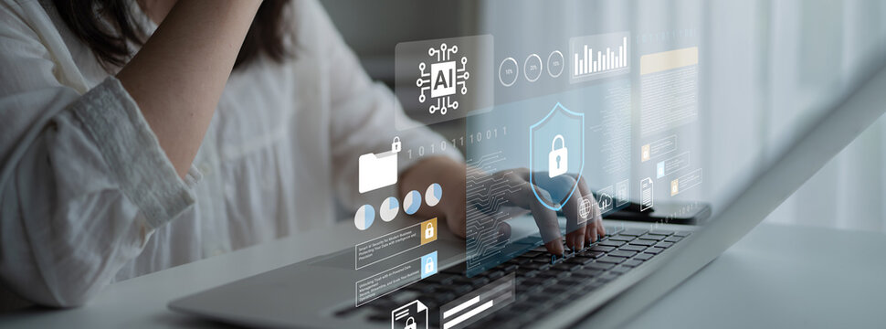 A woman interacts with a laptop showcasing a digital interface with data analysis and cybersecurity visuals, emphasizing technology in a professional environment. Gantry