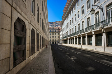 Fototapeta premium Street in Historic Lisbon with Sunlight & Shade