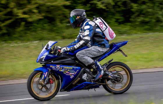 Milton Keynes,Bucks,UK - May 21st 2026:  Man riding a 2011 Yamaha YZF motorcycle driving on a British road