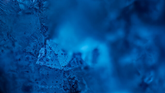 Luminescence of rare arctite crystal under ultraviolet light macro shot from Khibiny Mountains