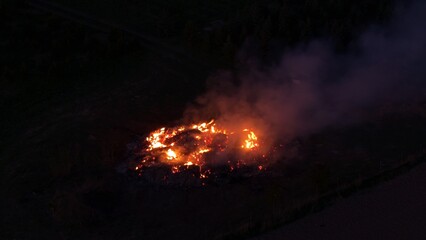 Fototapeta premium Traditional Walpurgis Night bonfires burning across Czech countryside during evening celebration