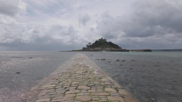 Cornwall, UK - May 14, 2026: St. Michael's Mount and cobbled causeway to the island when the tide coming in