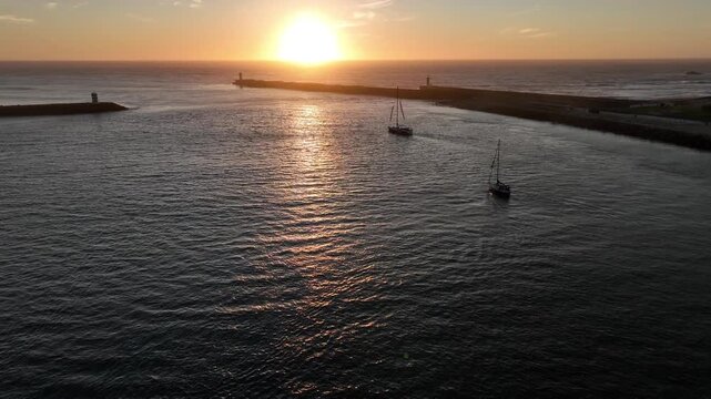 Aerial Cinematic View of Sailing Vessels at Sunset in Foz do Douro Porto Portugal Coast
