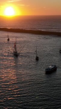 Aerial Cinematic View of Sailing Vessels at Sunset in Foz do Douro Porto Portugal Coast