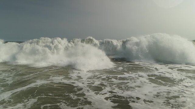 Cinematic Slow Motion Drone Footage of Ocean Wave Formation and Break