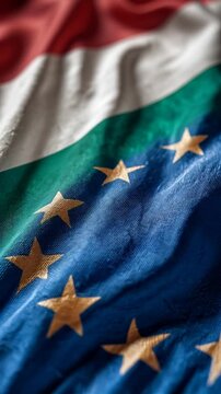 hungarian and eu flag waving together. hungary member european union