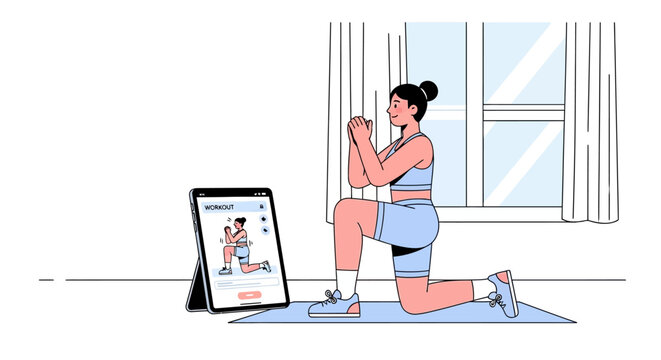 Woman exercising at home following online fitness class on tablet.